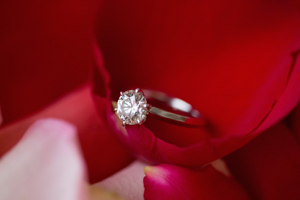 engagement ring on rose petals